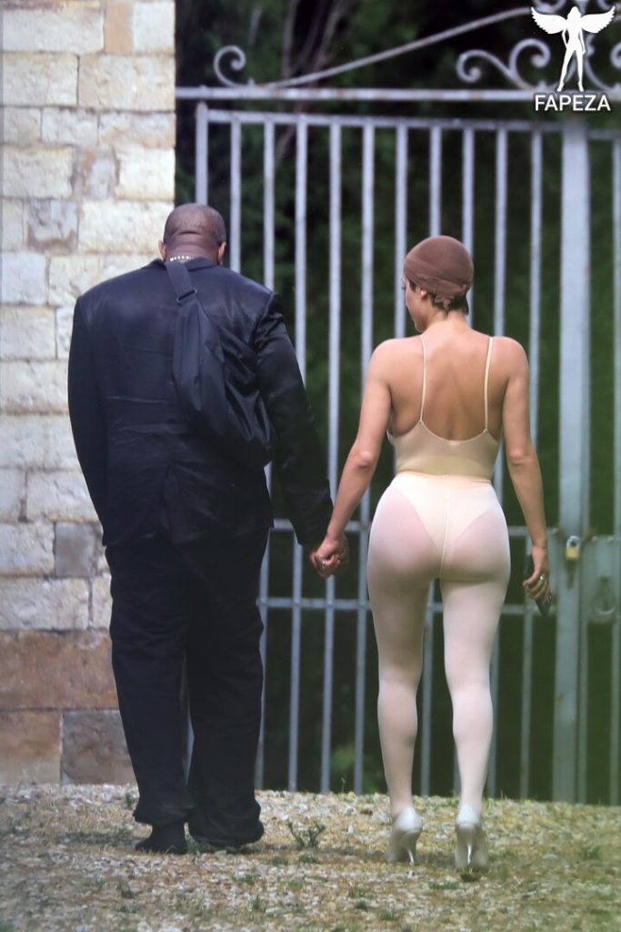 *PREMIUM EXCLUSIVE* *MUST CALL FOR PRICING* Controversial rapper Kanye West is seen with his wife Bianca Censori who rocks a see through outfit while out in Tuscany.